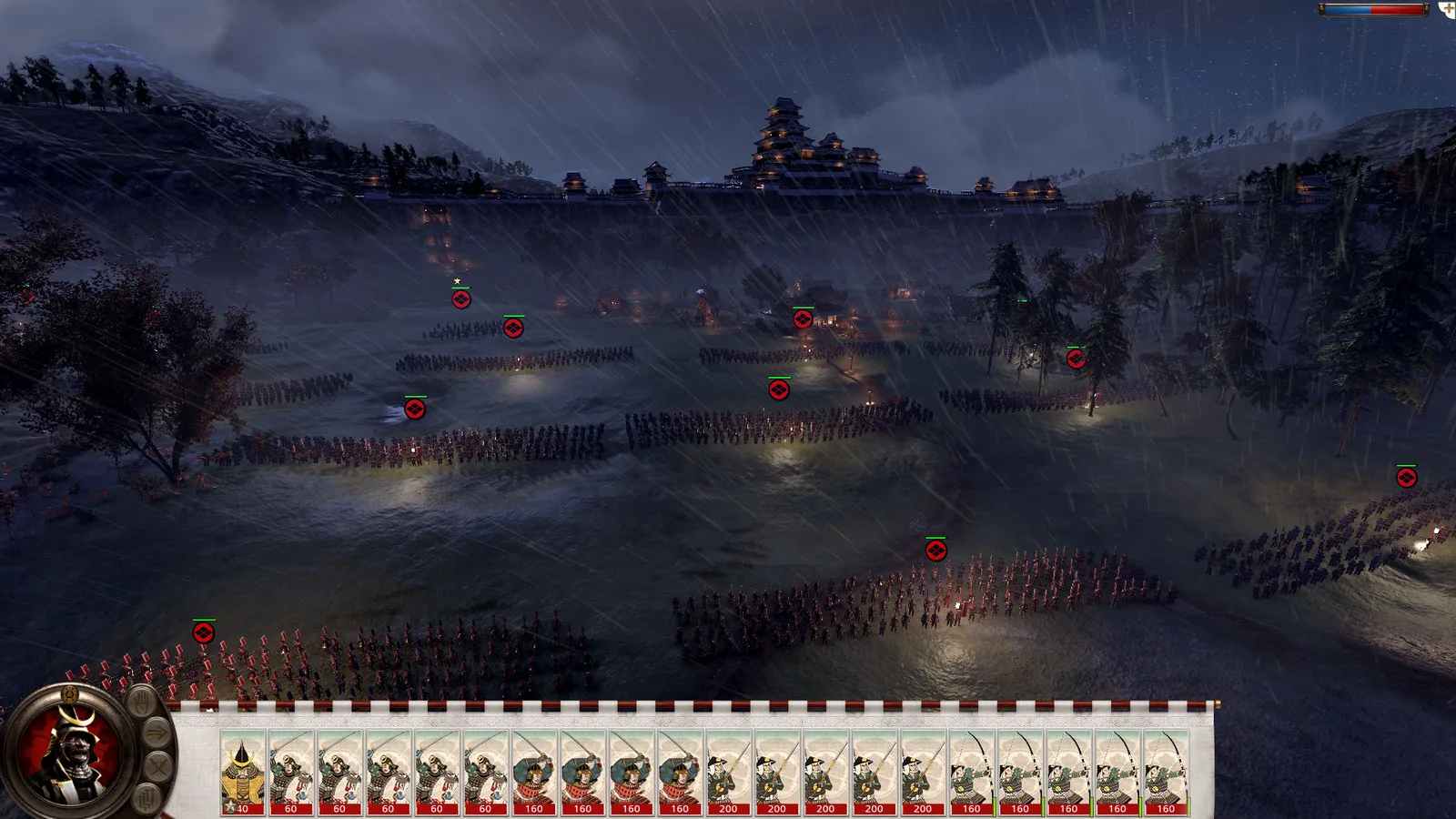 The original Shogun 2 battle interface showing unit cards and formations fighting during a night battle.