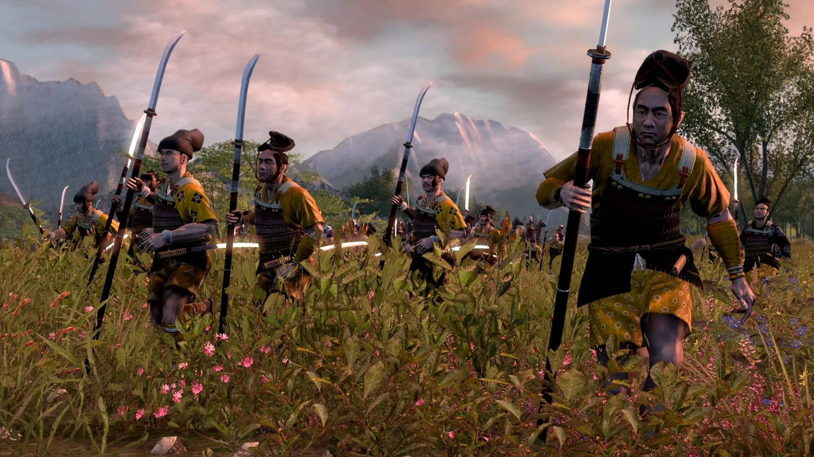 Rise of the Samurai infantry advancing through grass with curved polearms and bows.